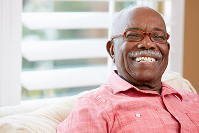 man showing off his smile after getting dental implants in Simi Valley, CA