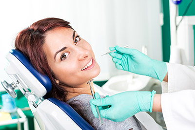 dentist cleaning a patient's teeth in Simi Valley, CA