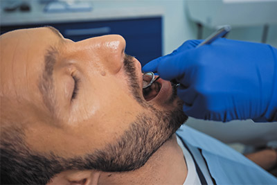 man receiving a root canal in Simi Valley, CA